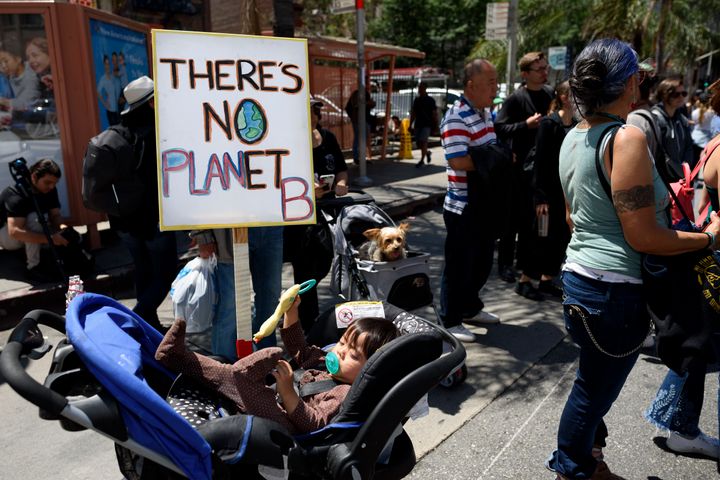 Students and environmental activists participate in a Climate Strike in Los Angeles in May. Organizers called on the Trump Ad