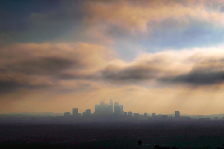 Downtown Los Angeles is seen shrouded in early morning coastal fog. Automakers and California recently launched private talks