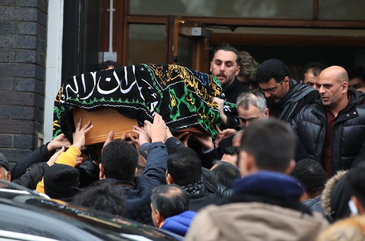 The coffin of 17-year-old Yousef Makki from Burnage, is carried from the Dar Al Hadi Foundation, in Manchester, following his funeral service.