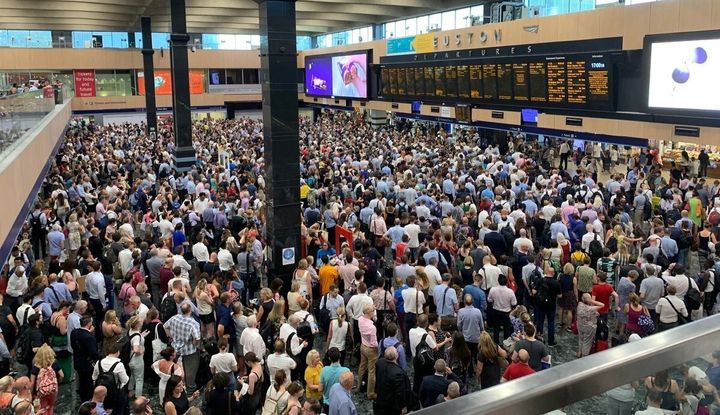 Crowds at Euston station in London, as commuters endured disruption on the railways as the UK sweltered on its hottest July day on record on Thursday.