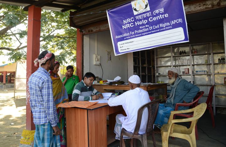 Villagers gather to check their documents at a National Register of Citizens help centre for people whose names were not featured in the final draft of the NRC at Hatisola village in Kamrup district in Assam. 