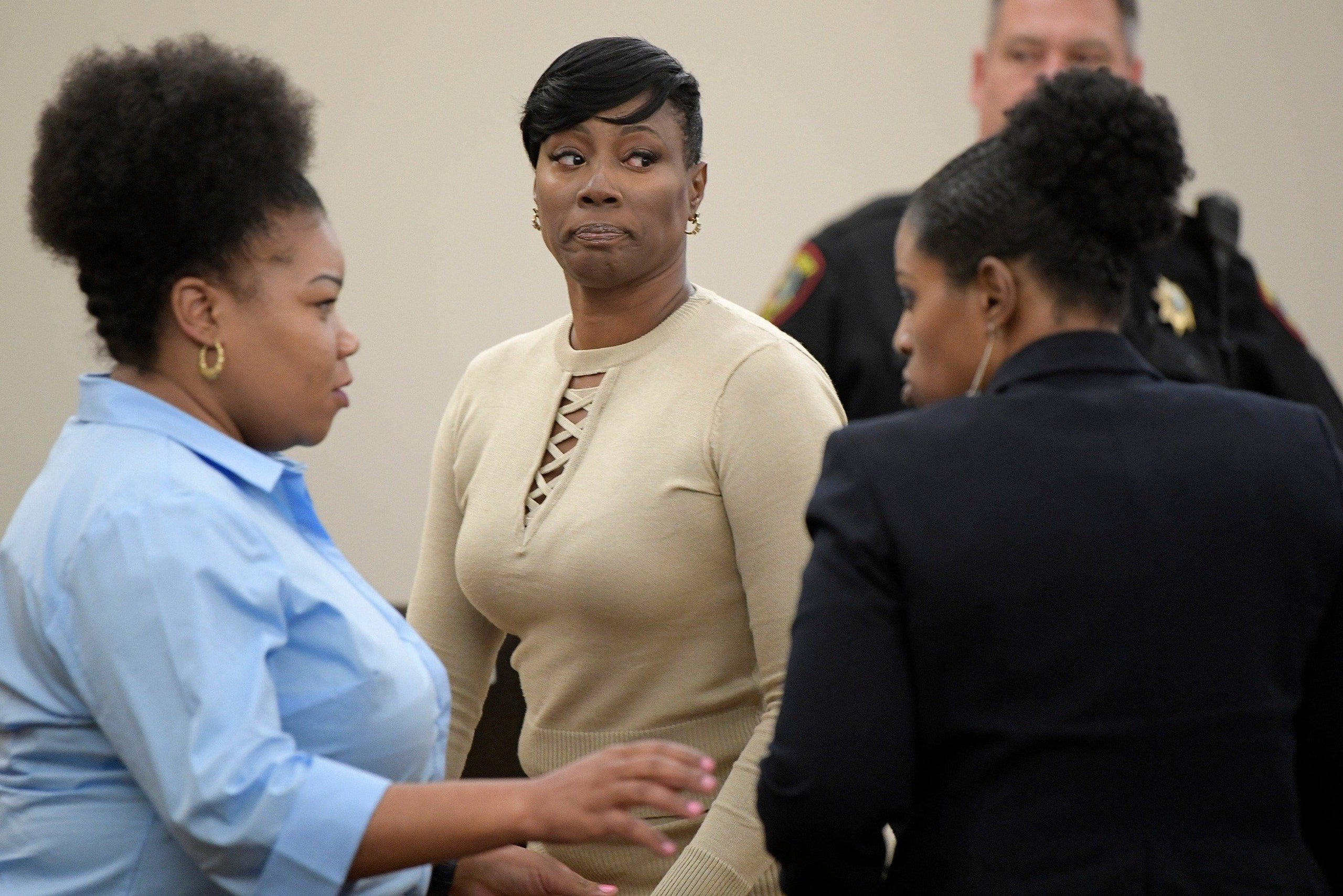 Crystal Mason, middle, during a break in Ruben Gonzalez's court at Tim Curry Justice Center in Fort Worth, Texas, on May 25, 