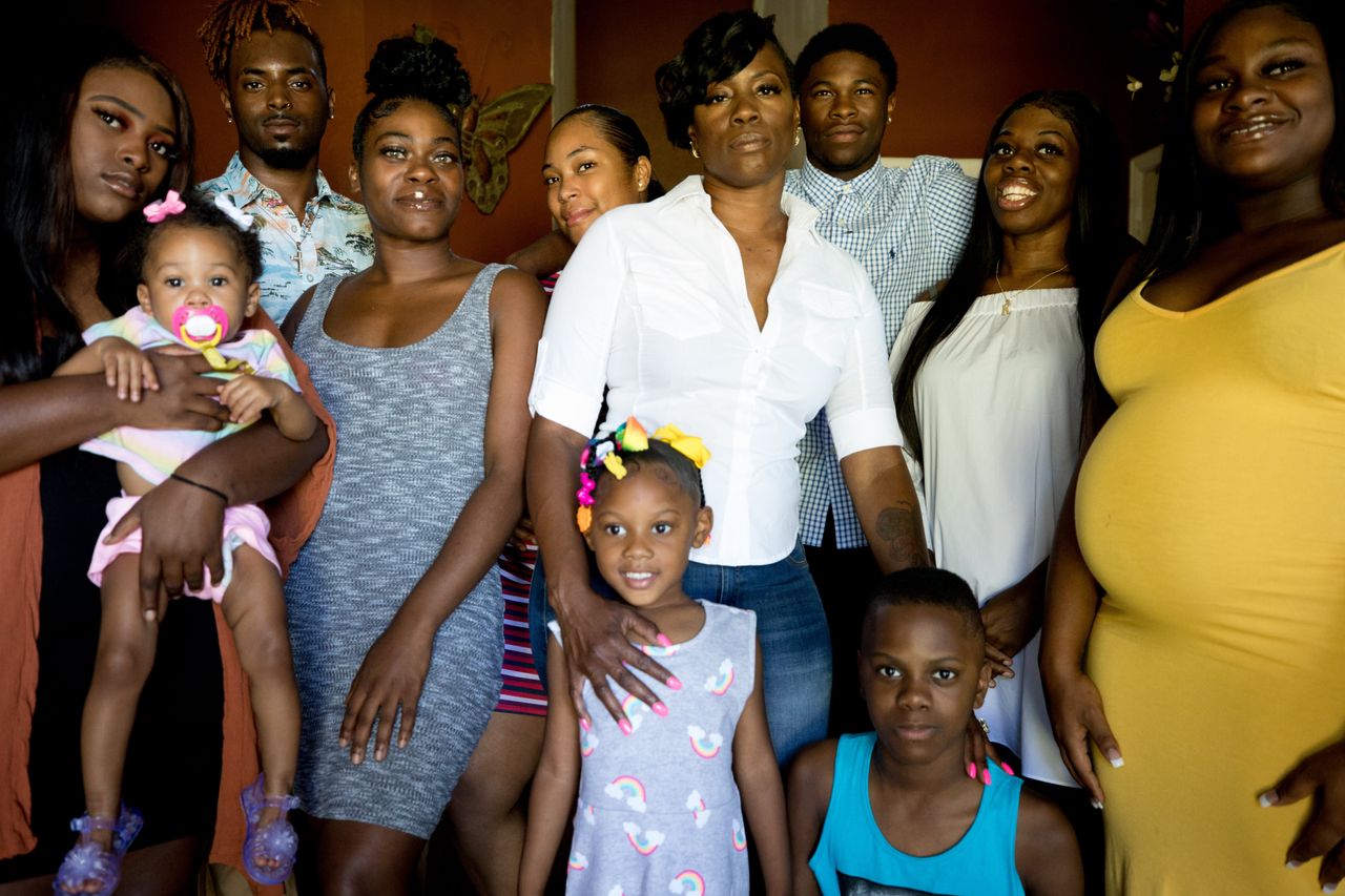 Mason, center, with her daughter Taylor, far left, and her biological children, adoptive children and grandkids that she raised in her home in Rendon, Texas.