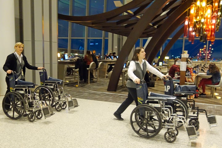 In this file photo, airport personnel manage wheelchairs at Toronto's Pearson International Airport.