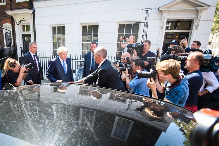 Boris Johnson leaves his campaign office in Great College Street, London, ahead of the announcement of the winner of the Conservative leadership contest.