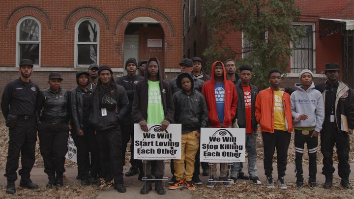 A group of Better Family Life outreach workers and youth volunteers spend a Sunday afternoon canvassing with their new signage in the Jeff-Vander-Lou neighborhood of St. Louis.