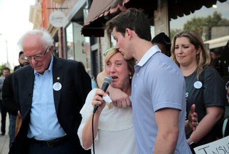 Hugo Sego who lives with type 1 diabetes, hugs his mother Kathy during a rally with U.S. Sen. Bernie Sanders after purchasing lower cost insulin in Windsor, Ont. on July 28, 2019.