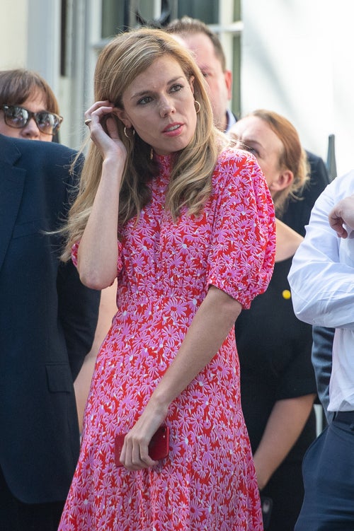carrie symonds pink dress Boris and Carrie Johnson applauded as they leave Downing Street for final time