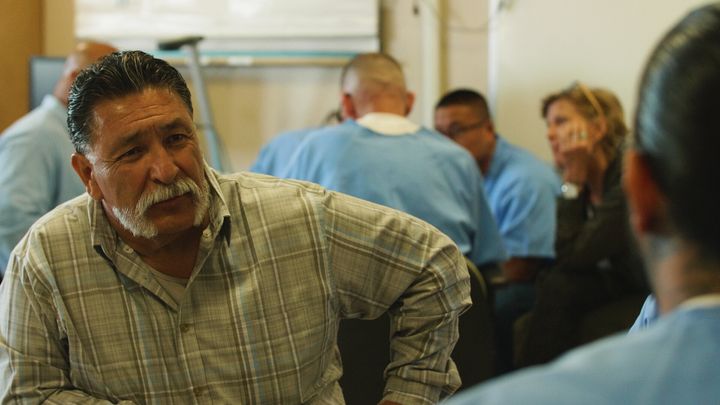 George Luna listening to an inmate during one of the small group breakouts during a GRIP training.