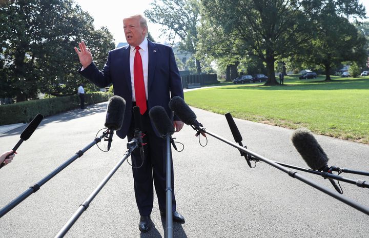 President Donald Trump talks to reporters as he departs for travel to Williamsburg, Virginia from the South Lawn of the White House on Tuesday.