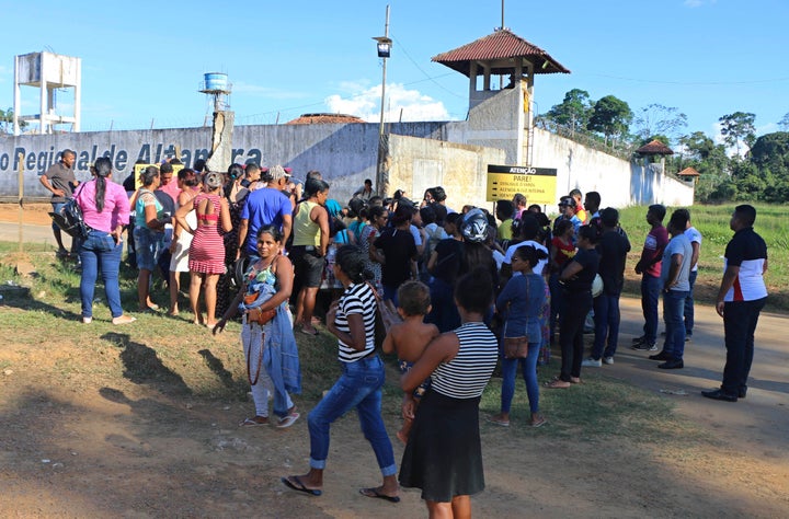 Family members of prisoners wait outside the Altamira correctional facility after 57 inmates were killed during a riot on Mon