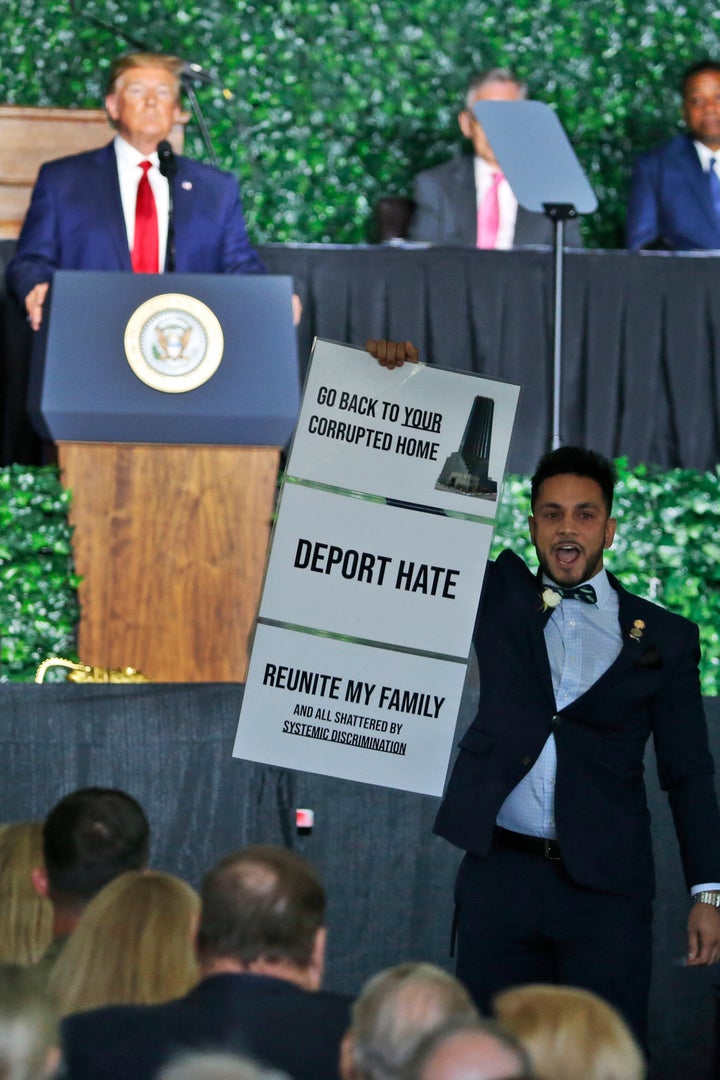 Virginia Del. Ibraheem Samirah (D) interrupts remarks by President Donald Trump in Jamestown, Virginia, on Tuesday.