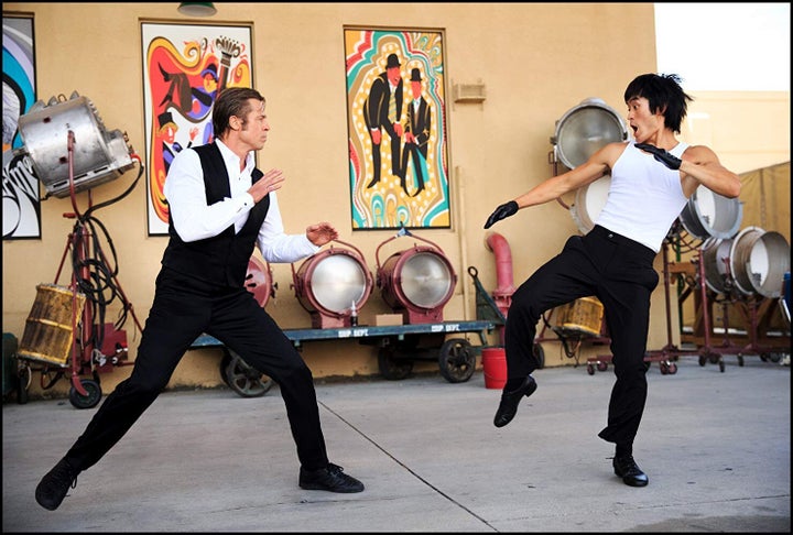 Cliff Booth (Brad Pitt) fighting Bruce Lee (Mike Moh) in Quentin Tarantino's "Once Upon a Time in Hollywood." Many Asian Amer