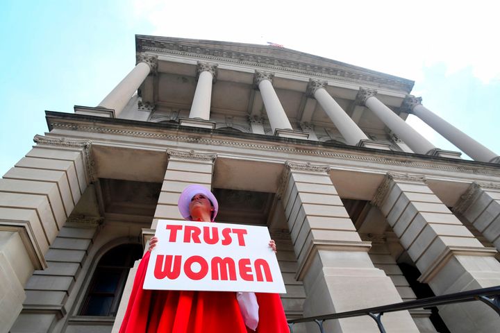 Activist Tamara Stevens with the Handmaids Coalition of Georgia stands outside the Georgia Capitol after Democratic presidential candidate Sen. Kirsten Gillibrand (D-NY) addressed an event to speak out against the recently passed "heartbeat" bill on May 16, 2019 in Atlanta, Georgia.