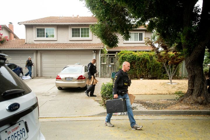 Police officers carry evidence bags from the family home of Gilroy Garlic Festival gunman Santino William Legan, Monday, July, 29, 2019, in Gilroy, Calif.