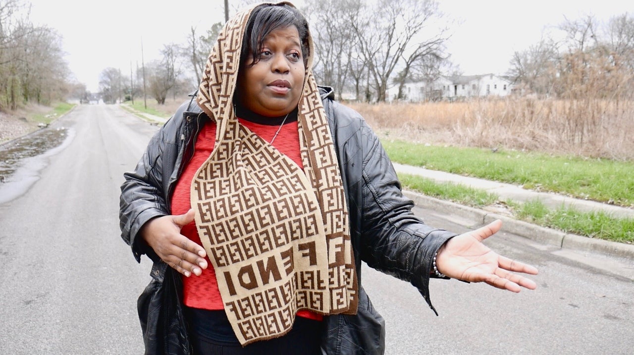 Keisha Brown gives a tour to a church group in her neighborhood, one of three in the EPA's Superfund site in North Birmingham.