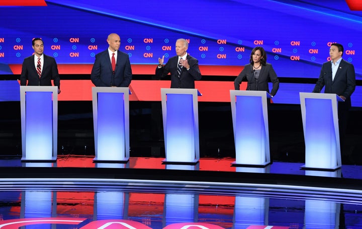 Democratic presidential hopefuls (L-R) Former US Secretary of Housing and Urban Development Julian Castro, US Senator from New Jersey Cory Booker, Former Vice President Joe Biden, US Senator from California Kamala Harris and US entrepreneur Andrew Yang speak during the second round of the second Democratic primary debate of the 2020 presidential campaign season hosted by CNN at the Fox Theatre in Detroit, Michigan on July 31, 2019. (Photo by Jim WATSON / AFP) (Photo credit should read JIM WATSON/AFP/Getty Images)