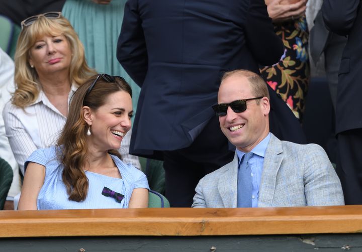The Duke and Duchess of Cambridge smile during Men's Finals Day of the Wimbledon Tennis Championships at All England Lawn Tennis and Croquet Club on July 14, 2019 in London.
