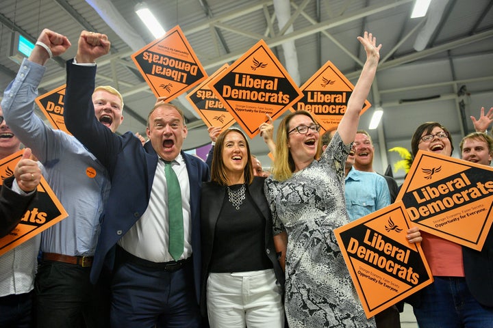 Lib Dem candidate Jane Dodds (centre) with Lib Dem MP Ed Davey (left) at the count in Brecon and Radnorshire 