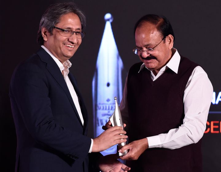 Ravish Kumar receiving Ramnath Goenka Excellence in Journalism Awards from Vice President Venkaiah Naidu for Hindi category in Broadcasting at a function, on December 20, 2017 in New Delhi.