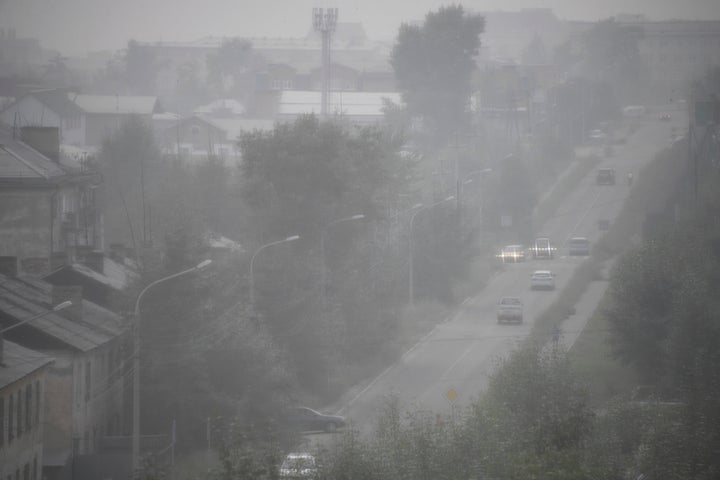 Heavy smoke covers the center of eastern Siberian city Chita, Russia, late Thursday, Aug. 1, 2019.