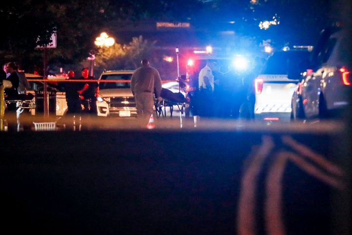 Bodies are removed from the scene of a mass shooting early Sunday in Dayton, Ohio.