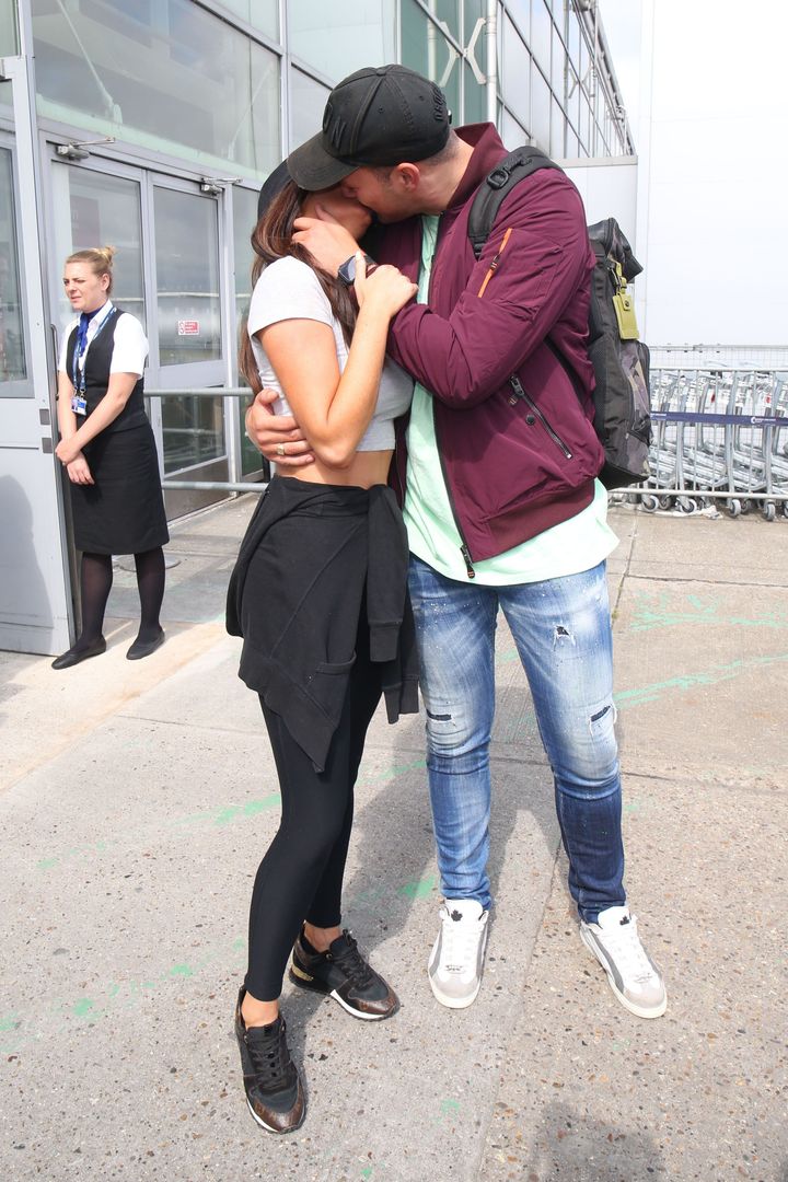 Maura and Curtis share a kiss after arriving in the UK