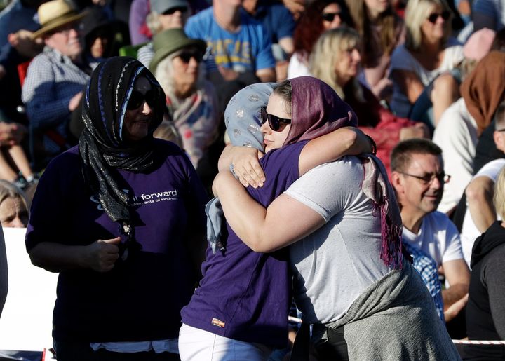 People embrace in a show of love during a vigil following the March 15 mass shooting in Christchurch, New Zealand.
