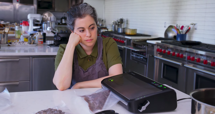 After experiencing a setback, Claire Saffitz of "Gourmet Makes" oversees her chocolate tempering process for making Twix.