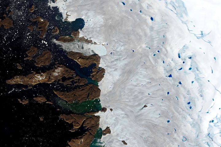 Meltwater ponds on the surface of the ice sheet in northwest Greenland near the sheet’s edge on July 20, 2019. This year has seen massive ice melt in Greenland and the Arctic.