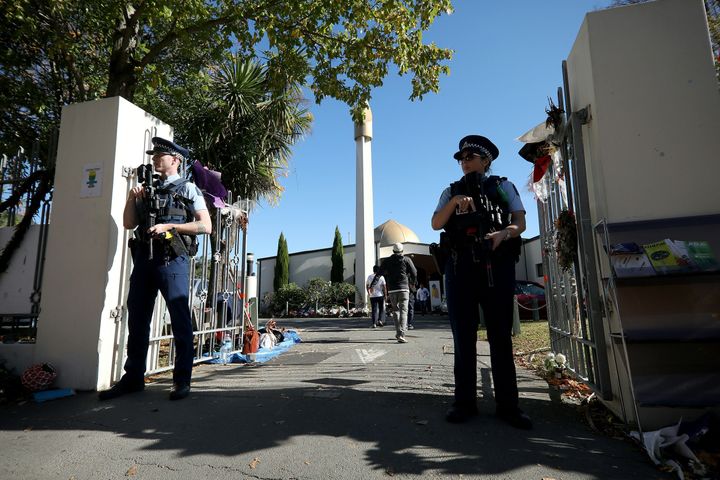 Armed police stand guard outside the Al Noor mosque in Christchurch, N.Z. where most of the victims of a mass shooting died.