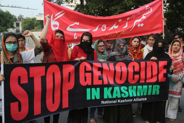 Pakistanis protest against India and express support and solidarity with Kashmiri people, in Lahore,...