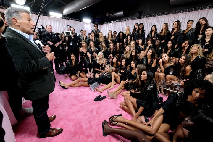 Ed Razek speaks to Victoria's Secret runway models backstage during the 2018 Victoria's Secret Fashion Show.