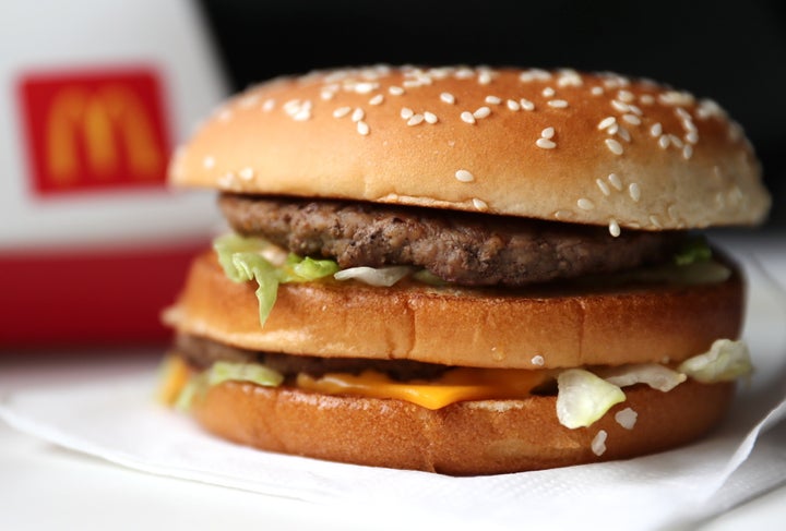 A Big Mac hamburger sits on a table inside a McDonald's restaurant in Russia on Feb. 25, 2019. The company says it has changed the way it cooks burgers in Canada.