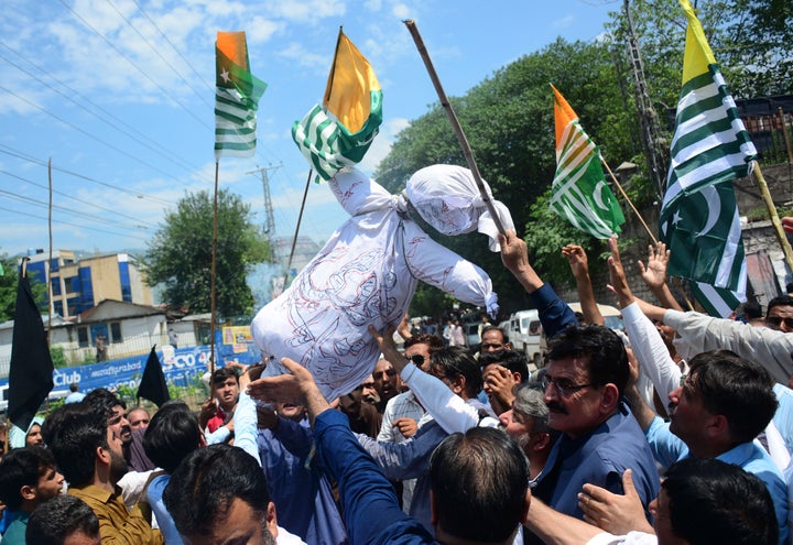 Pakistani Kashmiris carry an effigy of Indian Premier Narendra Modi during an anti-Indian protest in Muzaffarabad, capital of