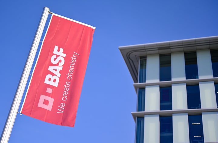 A flag with the logo of German firm BASF flutters at the company's headquarters in Ludwigshafen, Germany, Feb. 26, 2019. The petrochemical giant is considered a bellwether of the global economy.