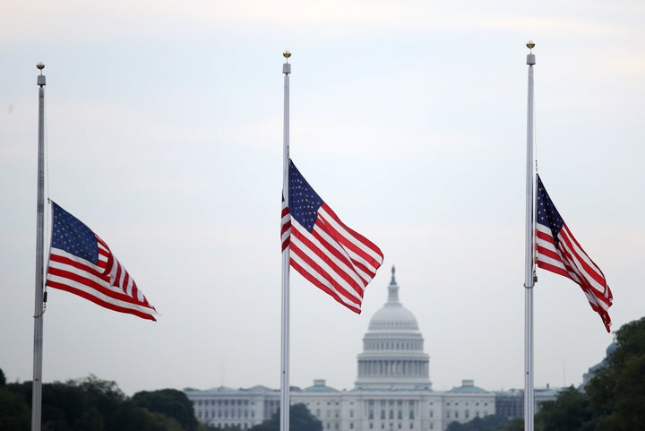 Flags fly at half-staff in Washington after more than 30 people died in mass shootings.