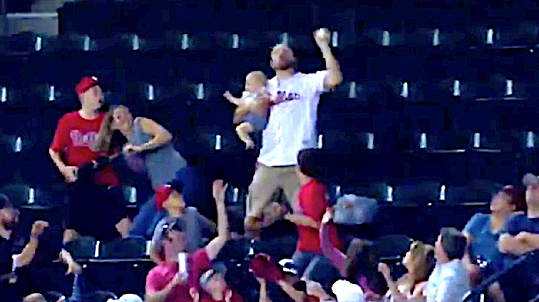 GIF: Fan Catches Home Run Bare-Handed While Holding a Baby