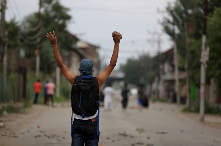 A Kashmiri protester shouts slogans during a protest in Srinagar on Friday