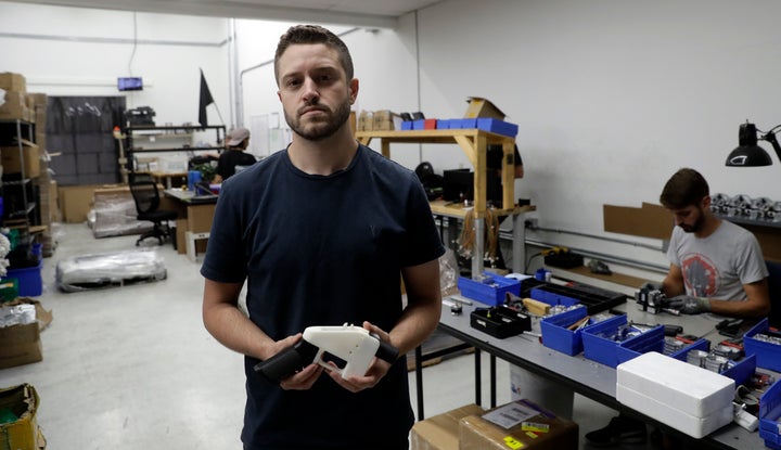 Cody Wilson and his fully 3D-printed gun.