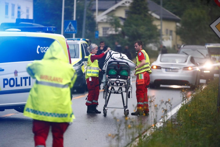 Emergency crews are seen near a stretcher after a shooting in al-Noor Islamic center mosque, near Oslo, Norway August 10, 201