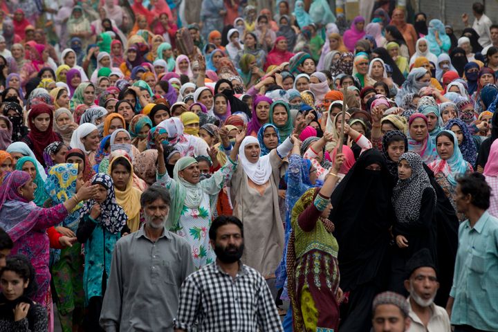 In this Friday, Aug. 9, 2019, photo, Kashmiri women shout slogans during a protest march in Srinagar, Kashmir. 