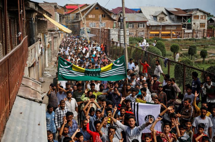 Kashmiri men shout slogans during a protest after the scrapping of the special constitutional status for Kashmir by the government, in Srinagar, August 11, 2019.