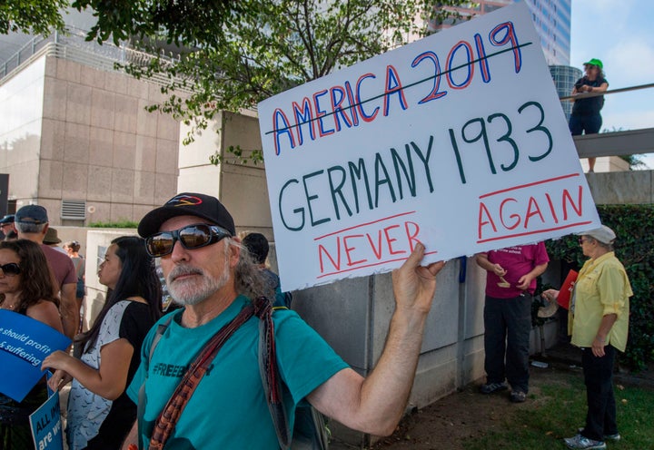 Protesters gather outside the Metropolitan Detention Center in Los Angeles on Sunday to protest the Trump administration's harsh crackdown on immigrants.