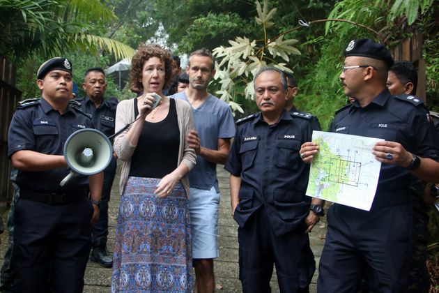 Nora's parents with the Malaysian authorities 