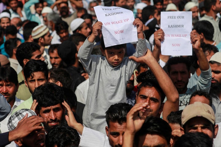 Kashmiris attend a protest in Srinagar on 12 August.