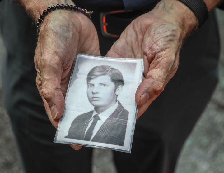 This Wednesday, Aug. 7, 2019 photo shows Brian Toale shows a photo of himself at 16 years old in New York. Toale, 66, who says he was molested by an employee at a Catholic high school he attended on Long Island, was one of the leaders in the fight to pass the Child Victims Act.