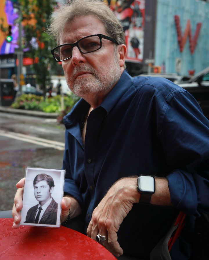 Brian Toale, a 66-year-old who says he was molested by an employee at a Catholic high school in Long Island, holds a photo of himself at 16 years old. 