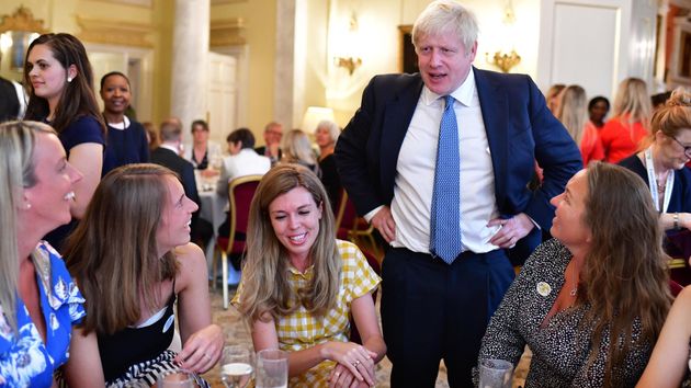 Boris Johnson and partner Carrie Symonds photographed at Downing Street reception on Monday.