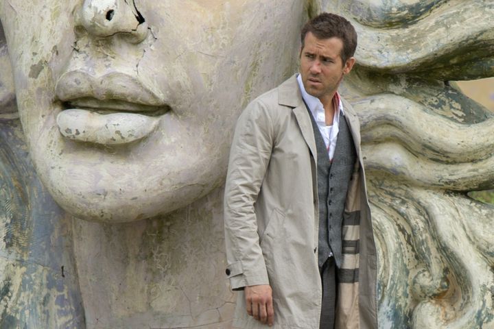 Ryan Reynolds blending into a large statue in "Self/less."